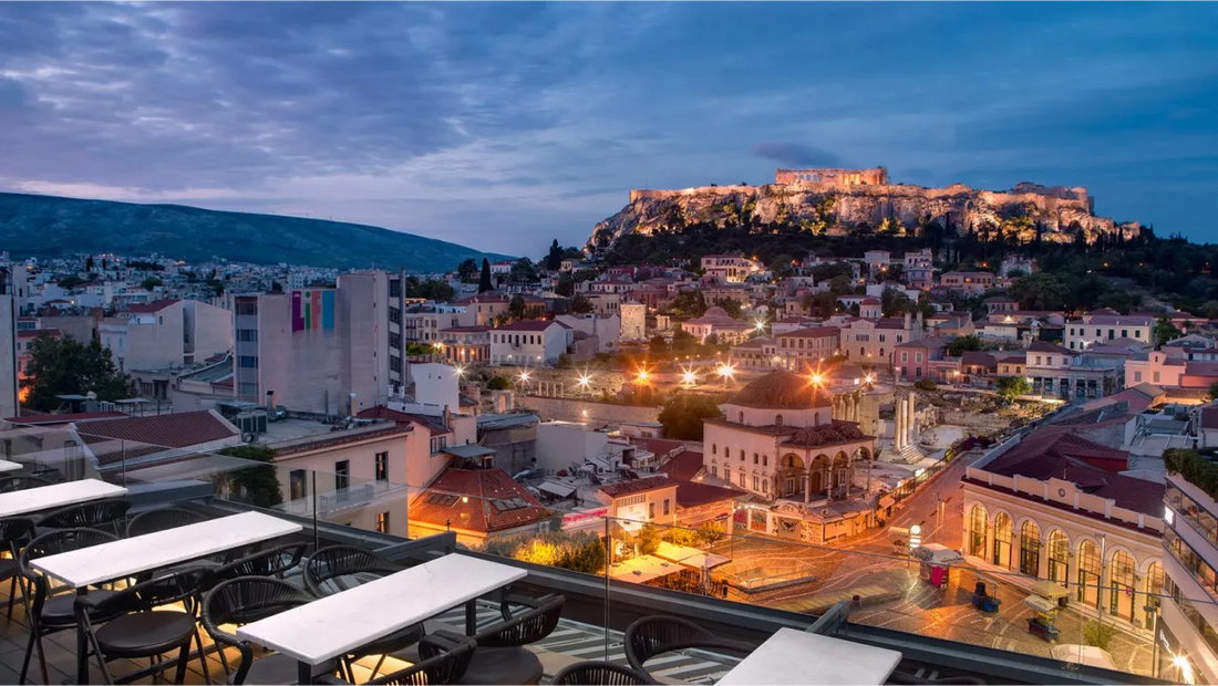 View of Athens with illuminated buildings and Acropolis at dusk