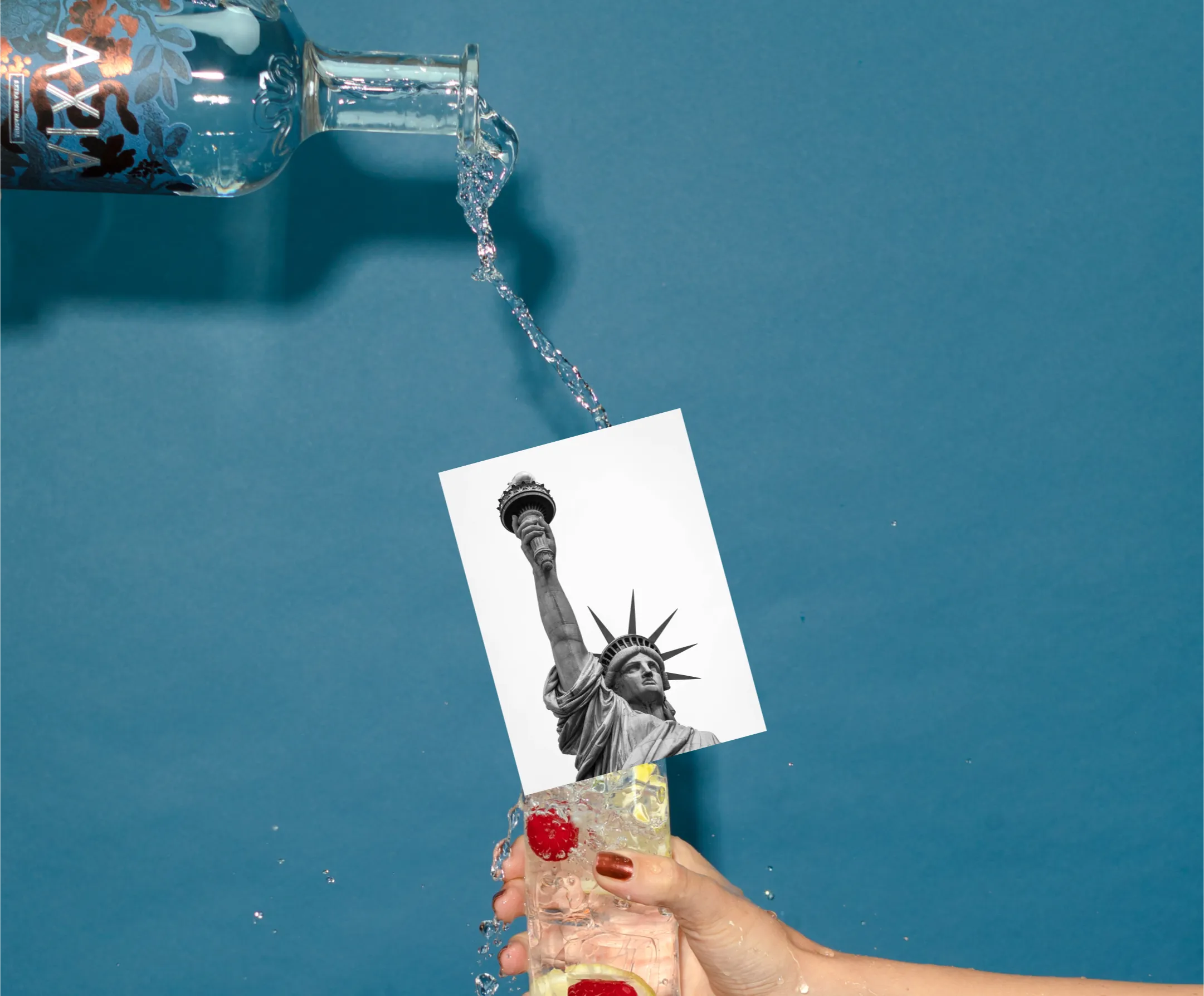 Axia Mastiha Spirit being poured in a cocktail glass with a picture of New York Statue of Liberty above