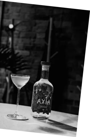 Black and white picture of an Axia Spirit Martini next to a bottle