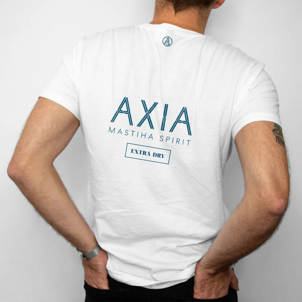 Man wearing the Axia Spirit White Cotton T-shirt branded merch on a light grey background. T-shirt has the Axia logo in the center and the small A icon at the top near neckline. Man is havings hands in back jeans pockets.