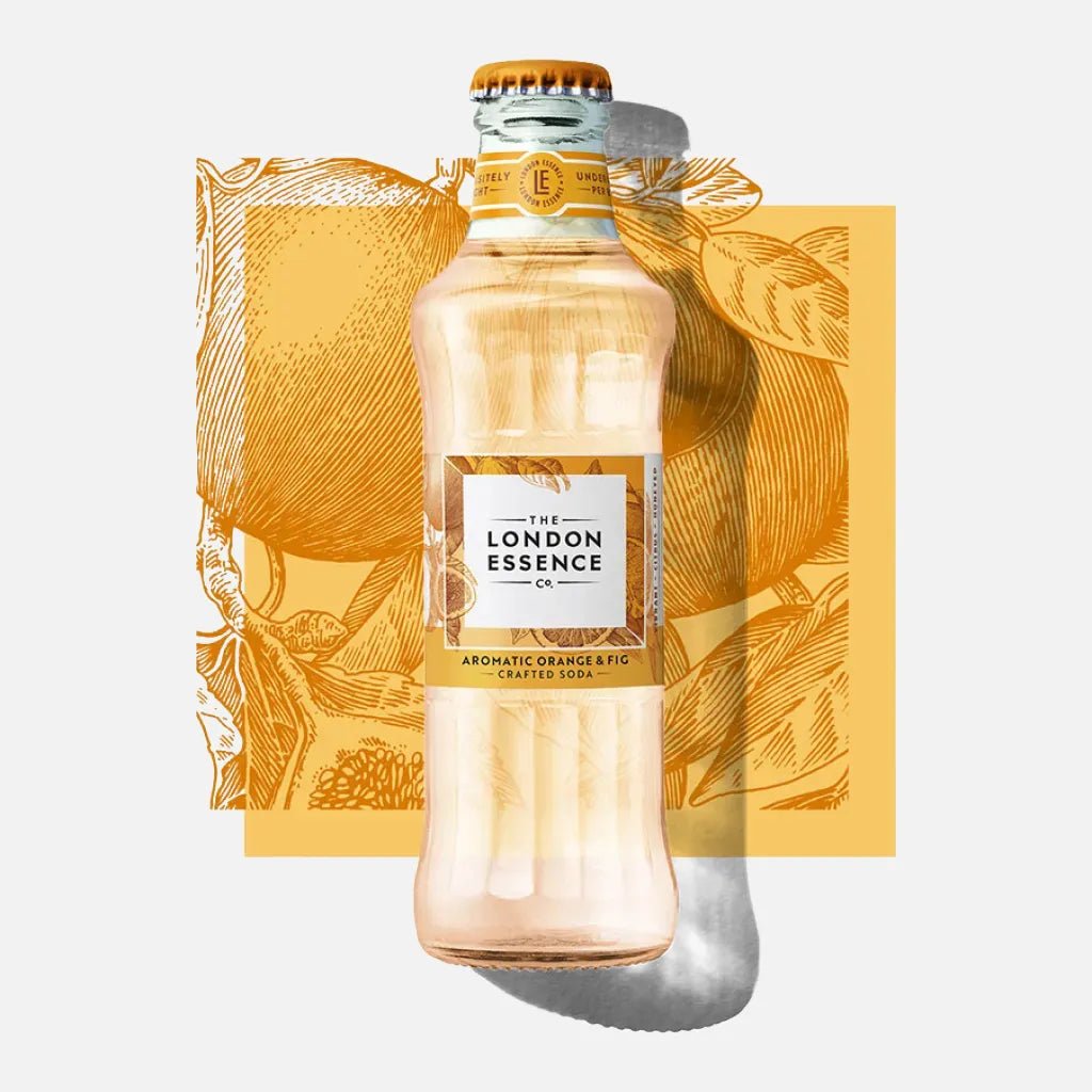 London Essence Aromatice Orange & Fig Soda glass bottle on light grey background with orange illustration