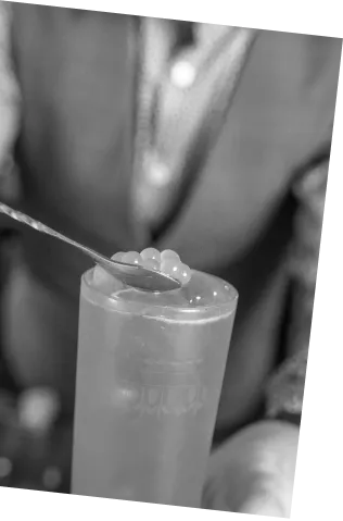 Black and white picture of an Axia Greek Mastiha Spirit and London Essence soda in a Louie London Cocktail