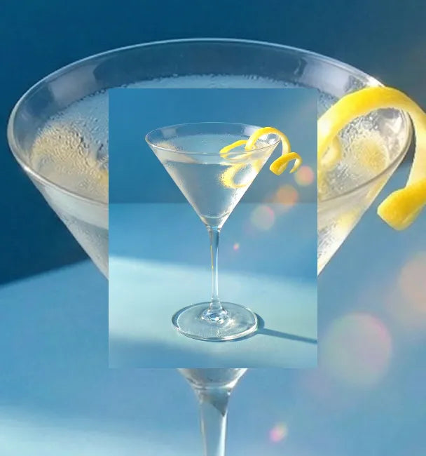 Axia Greek Mastiha Spirit Martini Cocktail with lemon peel on a light blue background with a secondary picture in the background of another Martini cocktail