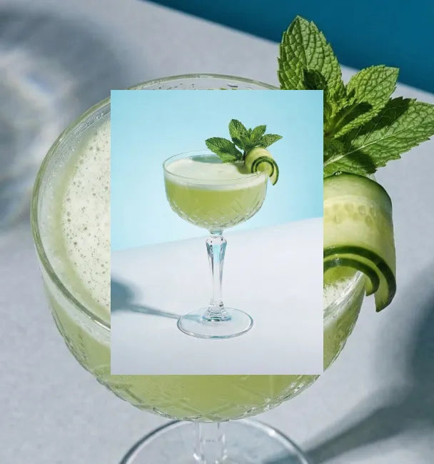 Axia Greek Mastiha Spirit Southside Cocktail with cucumber and mint leaves on a light blue background with a secondary picture in the background of another Southside cocktail