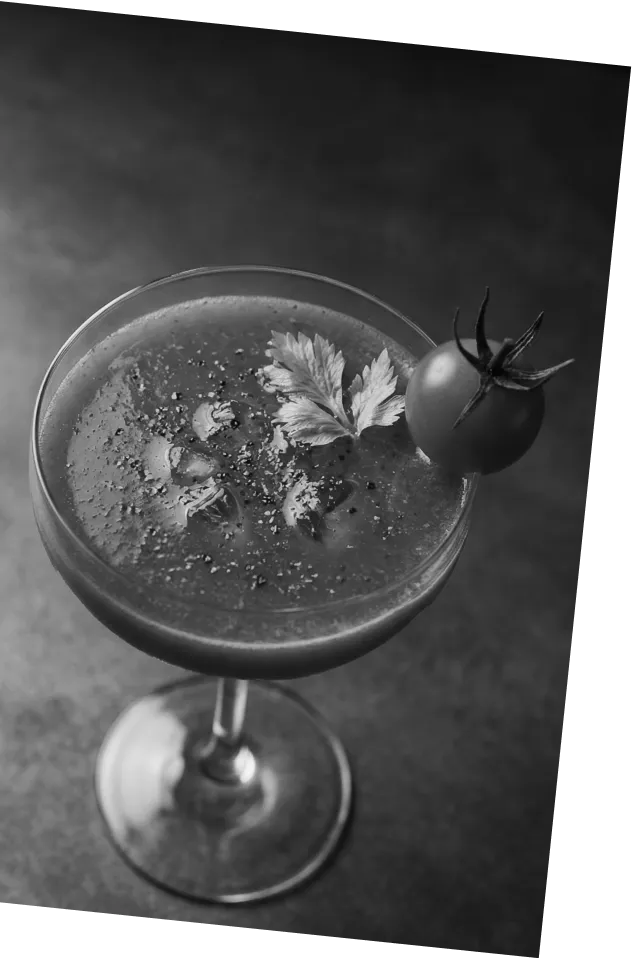 Black and white picture of an Axia Greek Mastiha Spirit Tomatini Cocktail with a cherry tomato