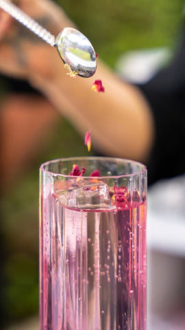 Axia Mastiha Spirit and London Essence Raspberry and Rose Soda with rose water and petals cocktail 