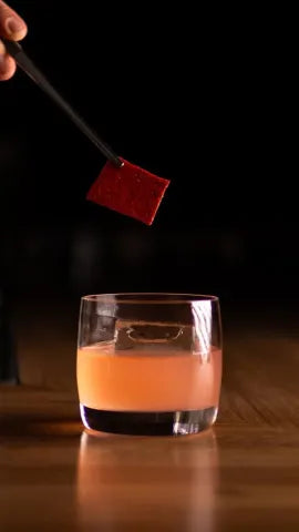 Axia Mastiha Spirit with A for Athens Cupid Cocktail on a wooden table