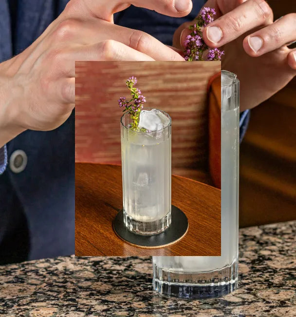 Axia Spirit and South Lodge Mediterranean Mule Cocktail on a bar for Salon Prive with a secondary picture in the background of another Mediterranean Mule cocktail