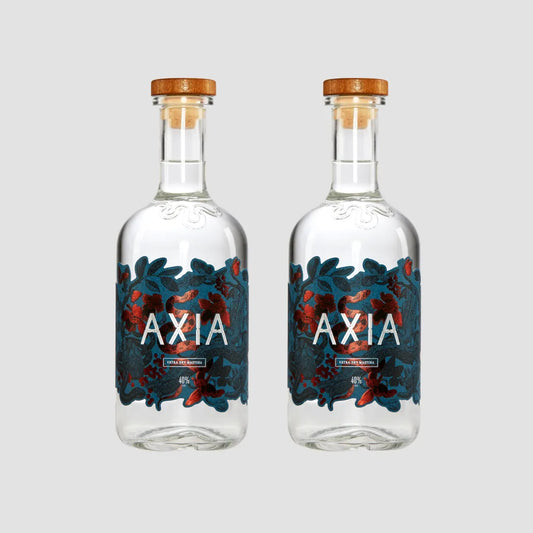 Two Axia Mastiha Spirit bottle on a plain light grey background