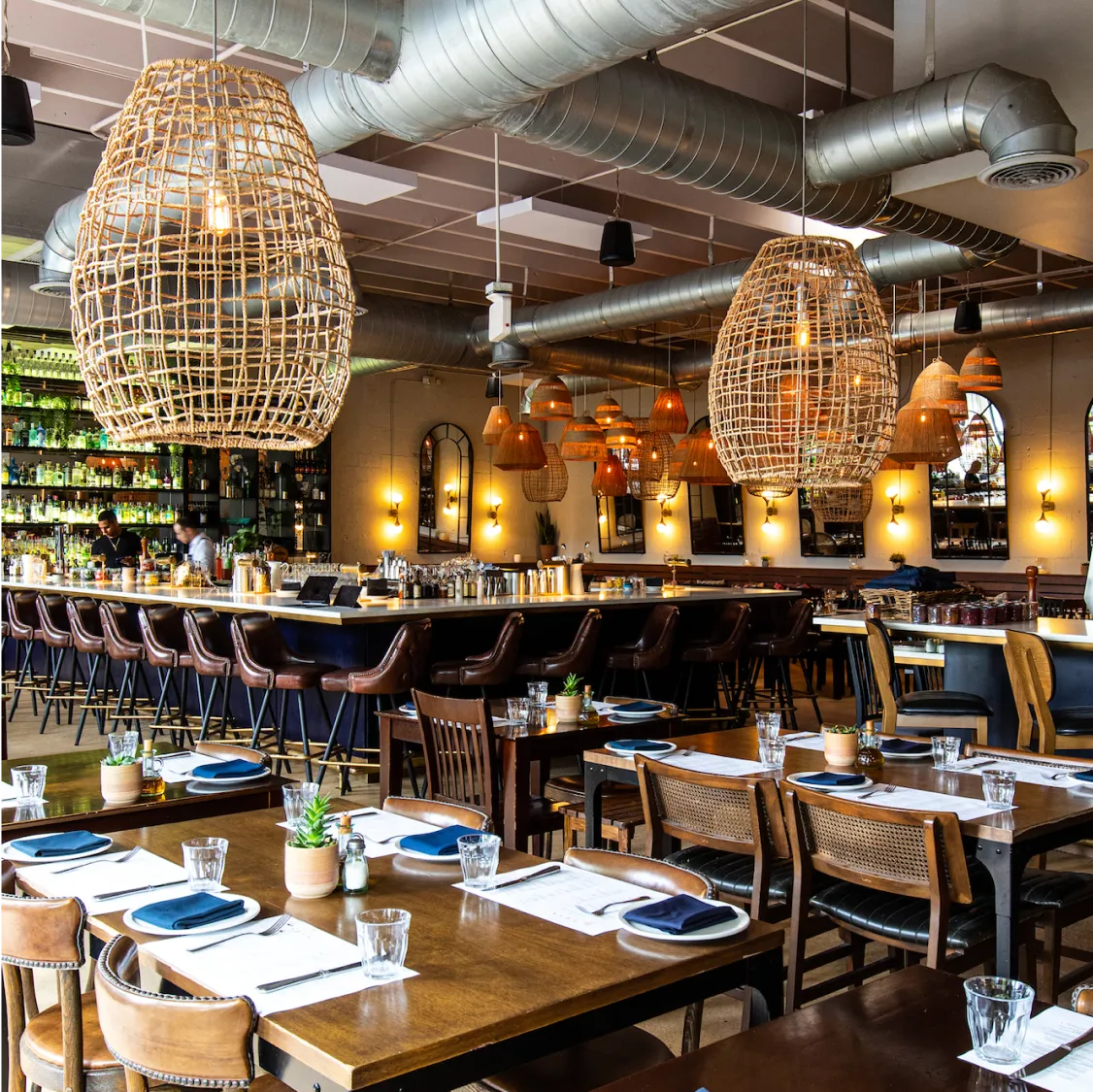 Doya Wynwood, Miami: Modern restaurant interior with woven pendant lights and a long bar.